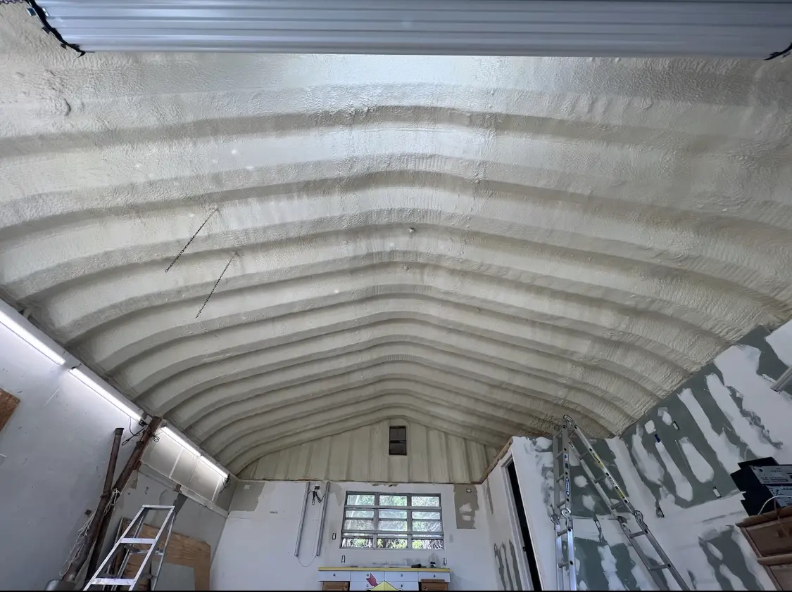 Spray polyurethane foam applied to the underside of a metal roof deck in San Angelo